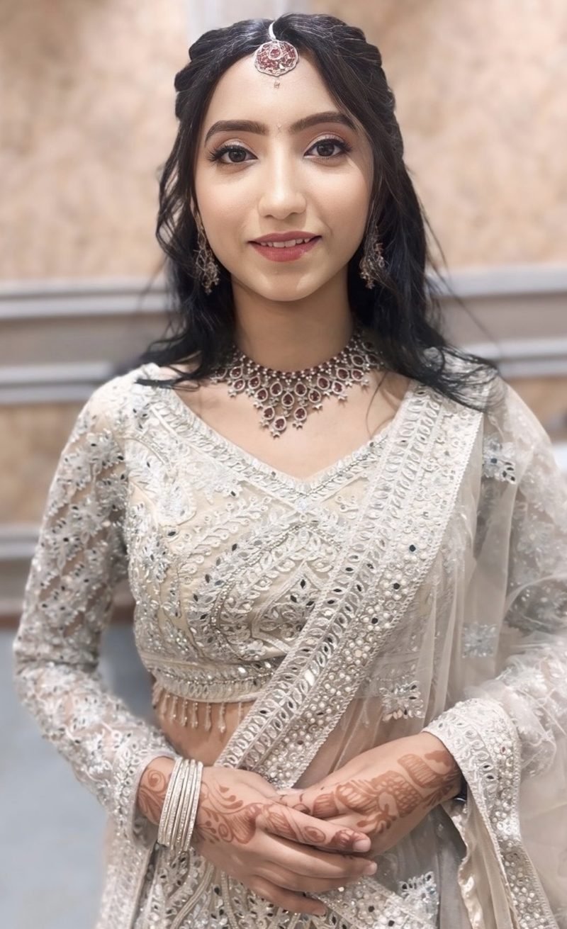 Soft makeup by Priya Gupta, client in an ivory lehenga